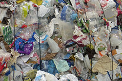 Mixed plastics (pots, trays and tubs) separated and baled ready for reprocessing.