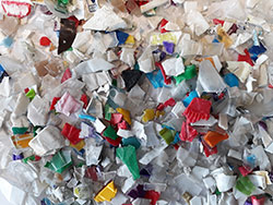 Processed mixed plastics (pots, trays and tubs) to be used in the manufacture of car dashboards.